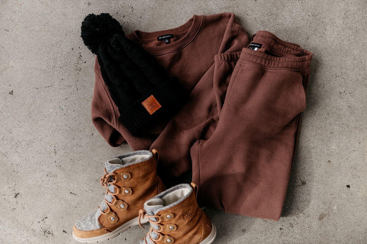 pom-beanie-evil-eye-logo-leather-infinity-beauty-bar